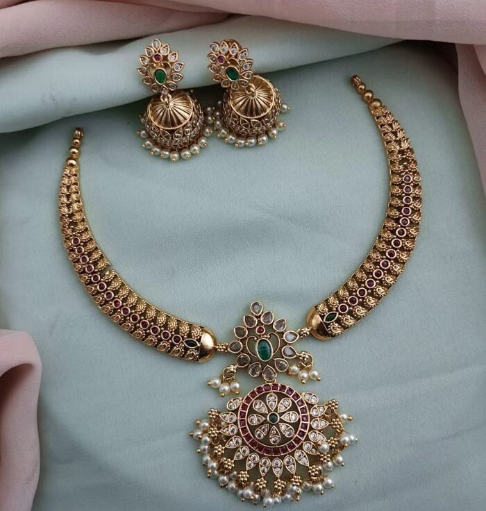 A vibrant green and red stone necklace set